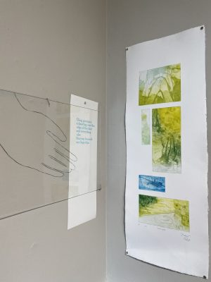IMG_8257 Prints with text and drawing of a hand on plexiglass