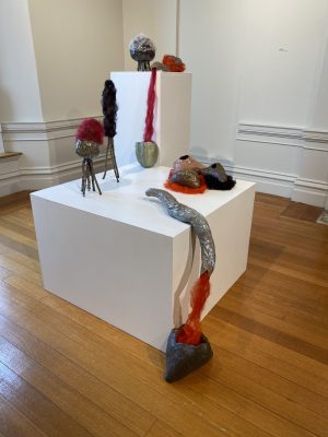 IMG_8408 ceramic objects with fibers and stick legs